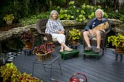 Top Christine Scotillo and Doug Peine, with their dog Gracie, view their backyard beds shaped by limestone walls. Above Concrete lambs accent the outd
