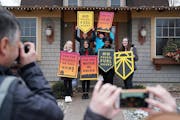Students from iMatter, a youth-driven organization focused on climate change, posed with signs after recording a message at Rep.-elect Dean Phillips�