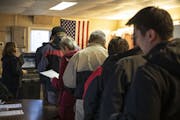 A long line formed at the tiny one room of Douglas Town Hall on Election Day on Tuesday, November 6, 2018, in the area of Douglas Township, Minn.