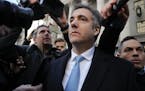 Michael Cohen walks out of federal court, Thursday, Nov. 29, 2018, in New York. Cohen, President Donald Trump's former lawyer, pleaded guilty to lying