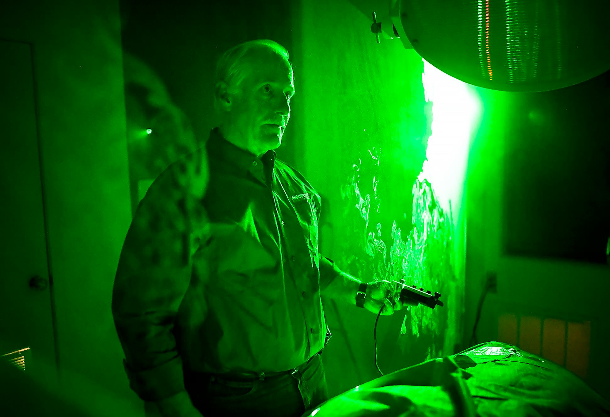 Dr. Scott Augustine gave a demonstration, using a fog machine and a laser to show the upward flow of air caused by the Bair Hugger device which he says contaminates the operating table. 