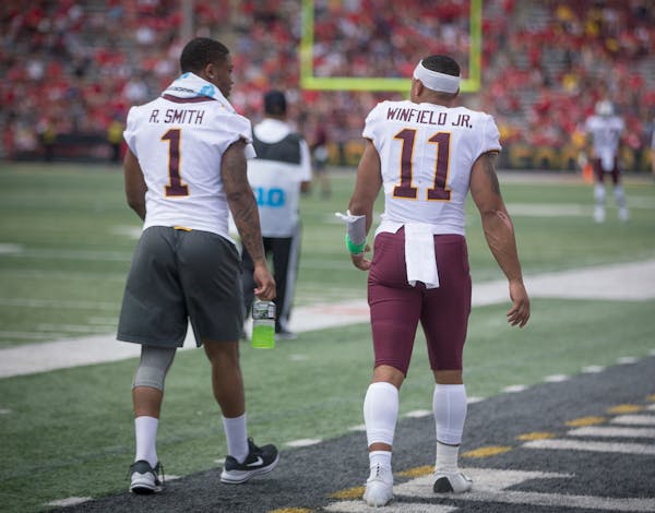 Running back Rodney Smith and defensive back Antoine Winfield Jr., both injured, made their way to the sideline after halftime as the Gophers took on 