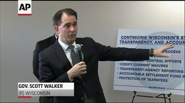 Scott Walker signs sweeping lame-duck GOP bills