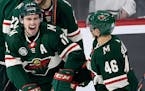 Wild left wing Zach Parise and defenseman Jared Spurgeon celebrated a goal by Parise against the Panthers