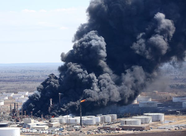 Thick smoke poured from the fire at the Husky Enery oil refinery in Superior, Wis.