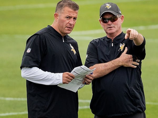 Mike Zimmer (right) and John DeFilippo earlier this season.