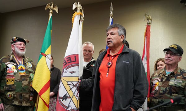 FILE - Leech Lake Tribal Chair Faron Jackson, Sr. presenting the tribal flag at the Juvenile Justice Center last month. Jackson testified before lawma