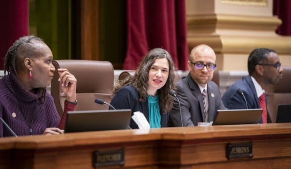 Minneapolis City Council President Lisa Bender, center, and other council members in December.