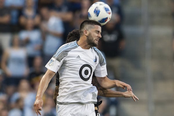 Minnesota United FC Defender Eric Miller (30) heads the ball away in a June 3, 2018 match between Sporting Kansas City and Minnesota United at Childre
