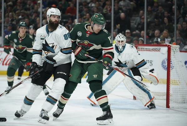 Wild left wing Marcus Foligno (17) eyed an incoming puck in the second period while the Sharks' Brent Burns (88) defended.