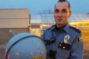 A St. Paul police officer holding the found finial on Tuesday night.