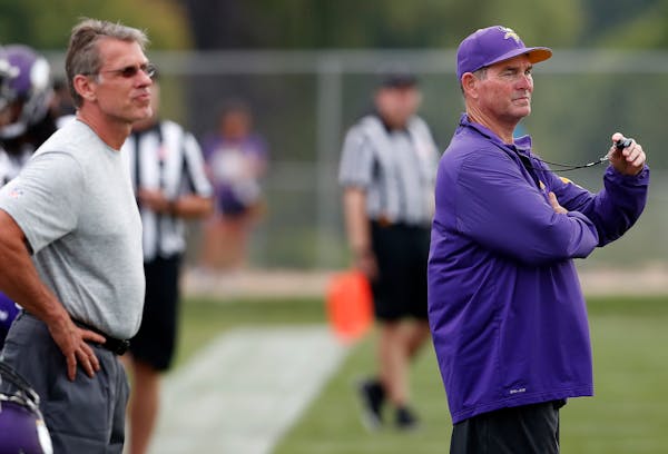 Vikings general manager Rick Spielman and coach Mike Zimmer watched afternoon practice in 2016.