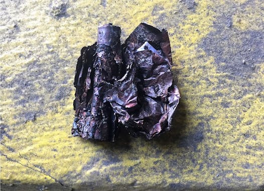 A burned battery found at Dem-Con Companies.