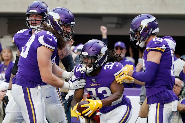 Tight end David Morgan (89) was among the Vikings to celebrate with running back Dalvin Cook after Cook's first touchdown Sunday.