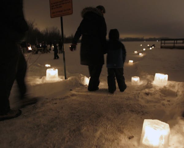 Visitors at Fort Snelling State Park walked along candlelit paths during a past New Year’s Eve celebration.