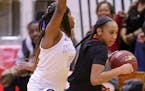 Minneapolis South's Jade Hill brings the ball up court past Minneapolis North defender Tiffany McNeill. Hill led all scorers with 22 points, helping t