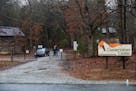 Conservators Center workers stand at the gate of the property in Burlington, N.C., Monday, Dec. 31, 2018. An intern was cleaning an animal enclosure a