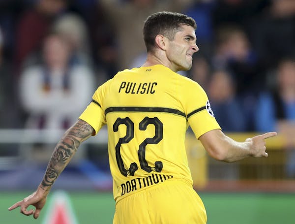 American Christian Pulisic celebrates scoring Borussia Dortmund's first goal during a Champions League group A soccer match between Club Brugge and Bo