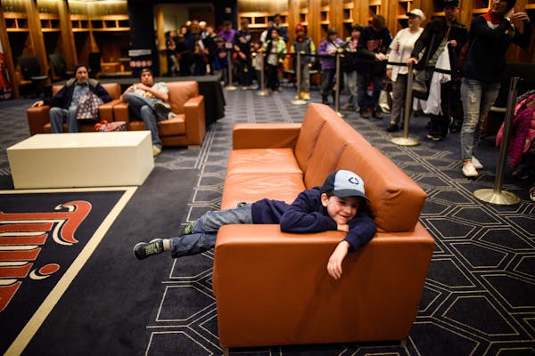 7-year-old Zach Hodgson relaxed in the Twins clubhouse during last year's TwinsFest at Target Field.