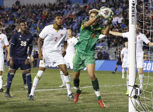 University of Maryland's Dayne St. Clair blocks the ball during the NCAA College Cup soccer championship against Akron on Dec, 9 at the University Cal