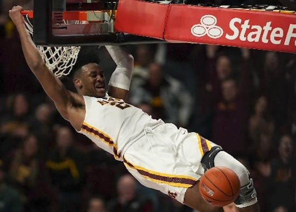 Forward Eric Curry helped cap the Gophers' 92-87 upset of No. 19 Iowa with a late second-half dunk at Williams Arena on Sunday.