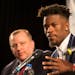 Jimmy Butler is flanked by Minnesota Timberwolves head coach Tom Thibodeau as he is introduced at Mall of America in Bloomington