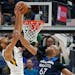 Wolves forward Taj Gibson defended Utah's Rudy Gobert in the first half Friday. Gibson was ejected in the third quarter.