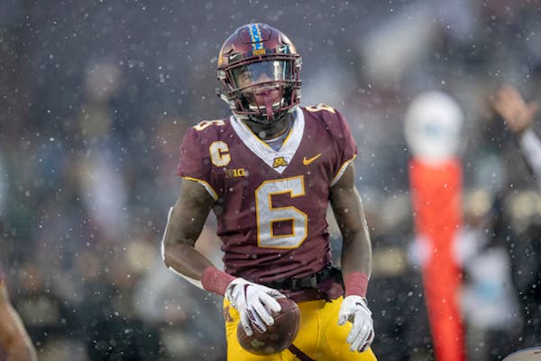 All-Big Ten wideout and former Minneapolis North standout Tyler Johnson tweeted Monday that he won't leave the Gophers early for the NFL draft.