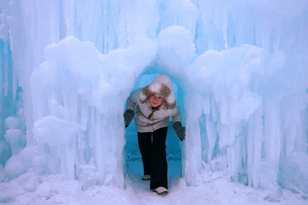 Zhenya Ratushko, 15, of Rochester, Minn. climbed out of an ice cave while exploring the Ice Castle in Excelsior last winter.