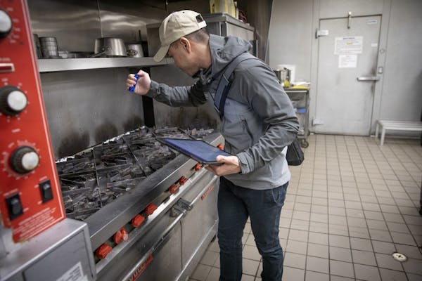 State food inspector Kevin Keopraseuth checked for cleanliness, sanitation and food temperature at a catering establishment. The findings are public i