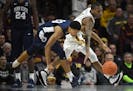 Minnesota Golden Gophers guard Dupree McBrayer (1) was called for a foul while reaching for the ball against Penn State Nittany Lions guard Rasir Bolt