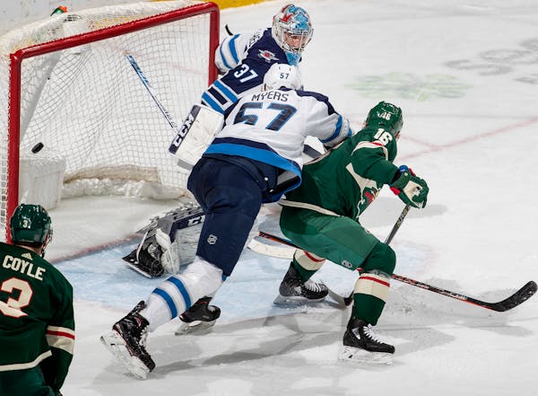 Jason Zucker got the puck past Jets goalie Connor Hellebuyck for a power-play goal in the second period.