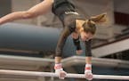 East Ridge High School's Cassie Kahrer on the uneven parallel bars during the Class 2A Gymnastics State Meet, Feb. 23, 2018, at the University of Minn