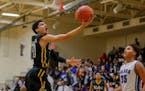 DeLaSalle's Tyrell Terry goes in for a layup against Minneapolis North. Terry had a game-high 23 points in the Islanders 66-57 victory over the Polars