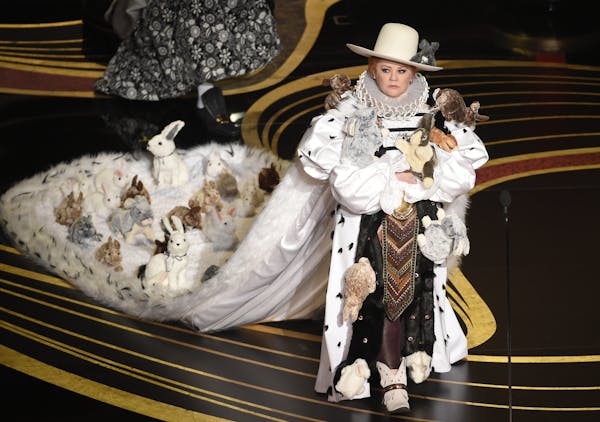 Melissa McCarthy walked on stage to present the award for best costume design Sunday at the Oscars.