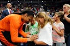 Minnesota Lynx forward Maya Moore signed an autograph for a young fan during Friday's practice.