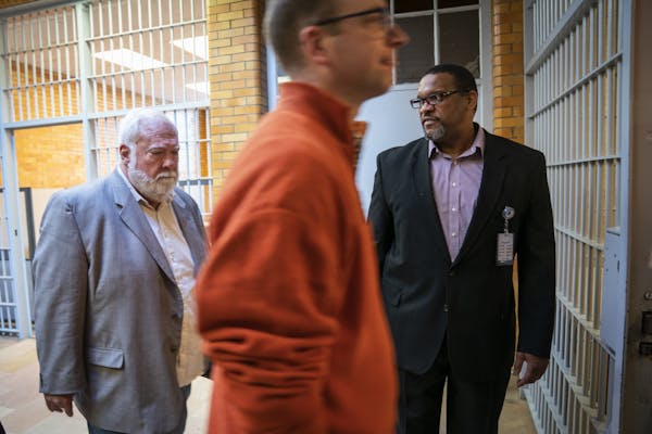 Warden Eddie Miles, right, led Minnesota House members Rep. Jack Considine Jr., left, and Rep. Brad Tabke, center, out of Stillwater prison at the end