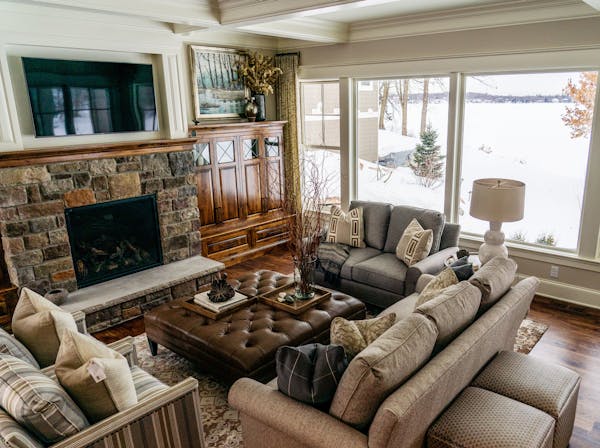 The living room has a wall of windows overlooking Lake Minnetonka.