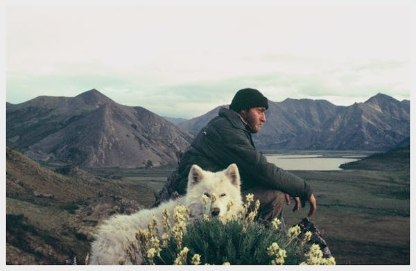 In a self-portrait, Jerry Pushcar of Minnesota, during his canoe odyssey in the late 1970s from New Orleans to Nome, Alaska. He is shown with his dog,