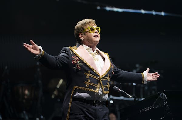 Elton John changed costumes twice Thursday night at Target Center, first appearing in a drum major’s outfit. His musical choices were all about the 