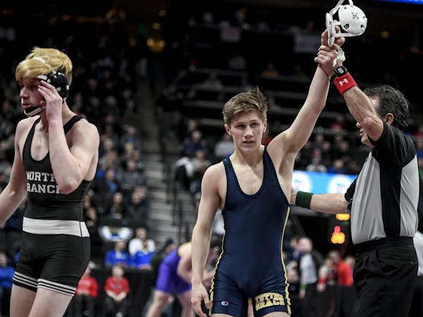 Jake Svihel, of Totino Grace, wrestled Brandt Bombard, of Northbranch, in a Class 2A 126lb quarterfinal match Friday. Svihel won with a pin at 2:58.