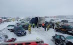 In this Sunday, Feb. 24, 2019, photo provided by the Winnebago County Sheriff’s Office, responders work at the scene of a chain-reaction pileup on I