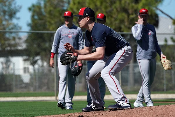 Twins pitcher Trevor May worked on fielding line drives with fellow pitchers last week in Fort Myers.