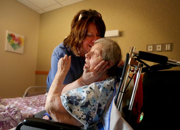 In this moment in 2017, Lisa Papp-Richards comforted her mother, Mary Ann Papp, 77, at a nursing home in Bemidji. Papp-Richards said the facility reta