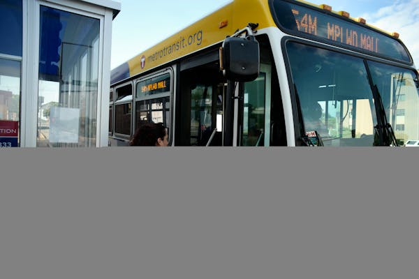 A woman boarded a Metro Transit bus.