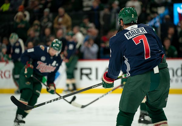 Wild defenseman Anthony Bitetto and the rest of the team wore Joe Mauer tribute sweaters during their pregame warmups Tuesday night.