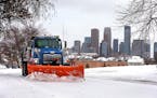 City of Minneapolis plow clears snow from a Olson Highway Service Road in Minneapolis.