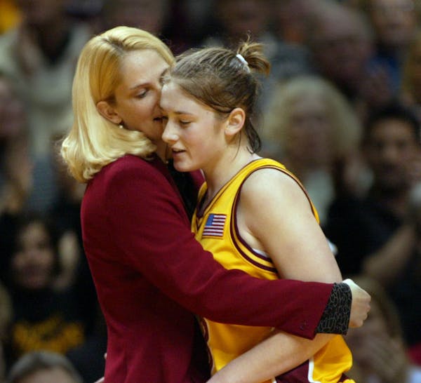 Coach coach Brenda Oldfield (now Frese) hugged Lindsey Whalen after a win over Purdue in 2002. Now, Frese is at Maryland and Whalen is coach of the Go
