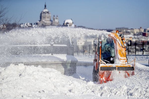 A city of St. Paul snow crew removed snow from the Smith Avenue Bridge, Friday, February 8, 2019 in St. Paul, MN.