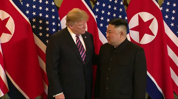 Trump and Kim shake hands in Hanoi